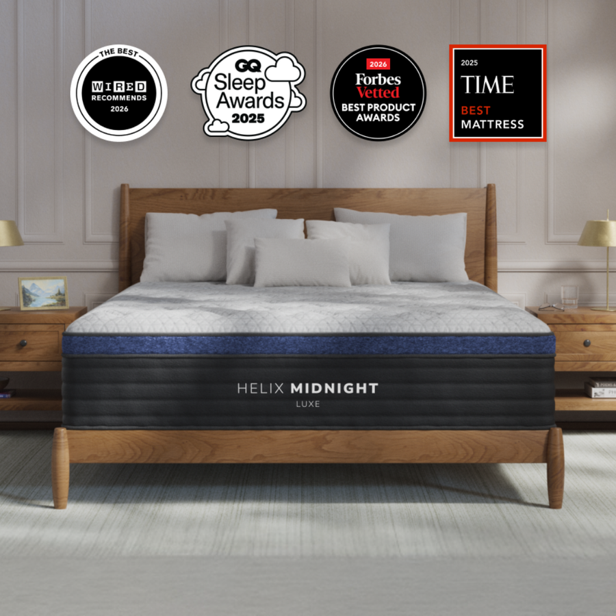 Helix Midnight Luxe pillow top mattress on a wooden bed frame, with mattress award badges above.