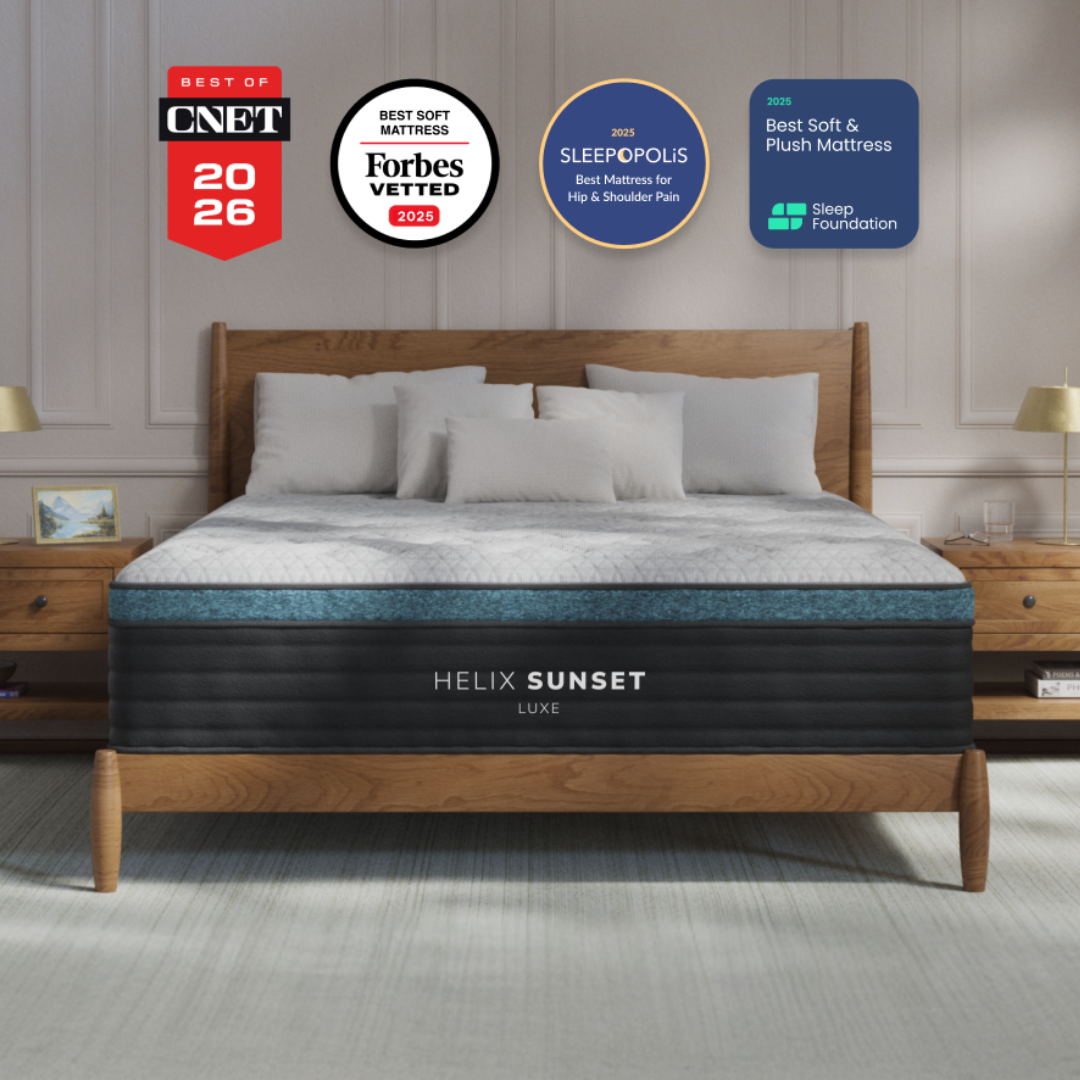 Helix Sunset Luxe pillow top mattress with teal trim on a wooden bed frame, with award badges above.